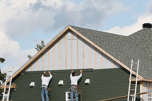 Professional Siding Contractor technician working in Harrison, NJ